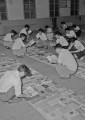 教科書を選択する先生たち＝熊本市手取本町の市教育委員会ホール